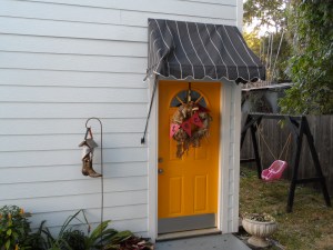 The door to the garage apartment is yellow.