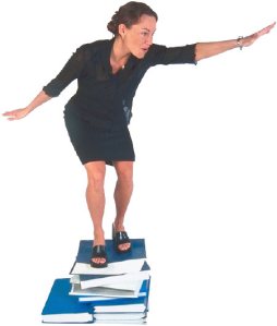 woman on stack of books uid 3